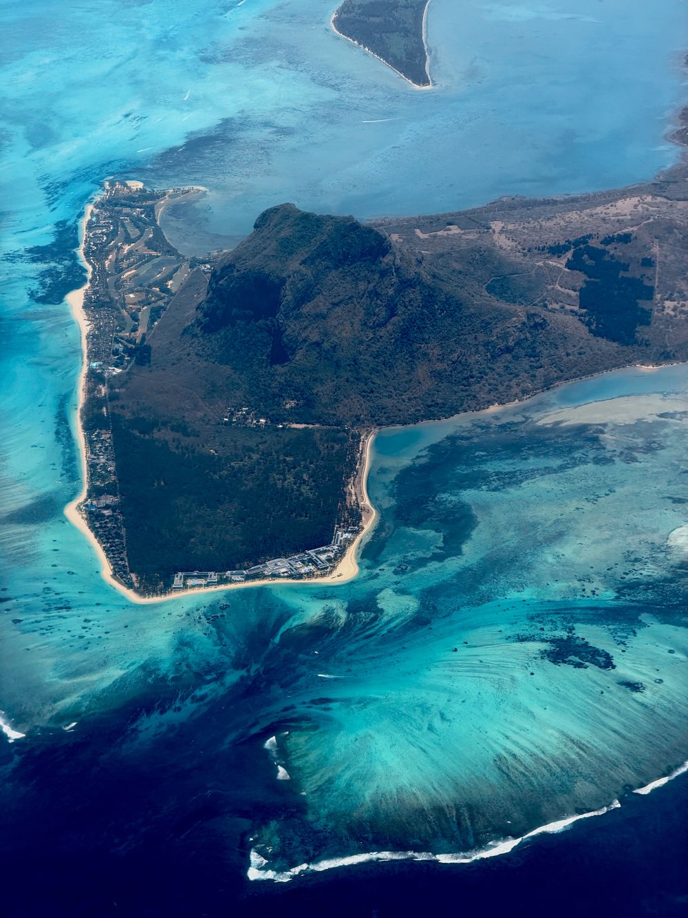 Aerial view of the Le Morne peninsula and its turquoise reef